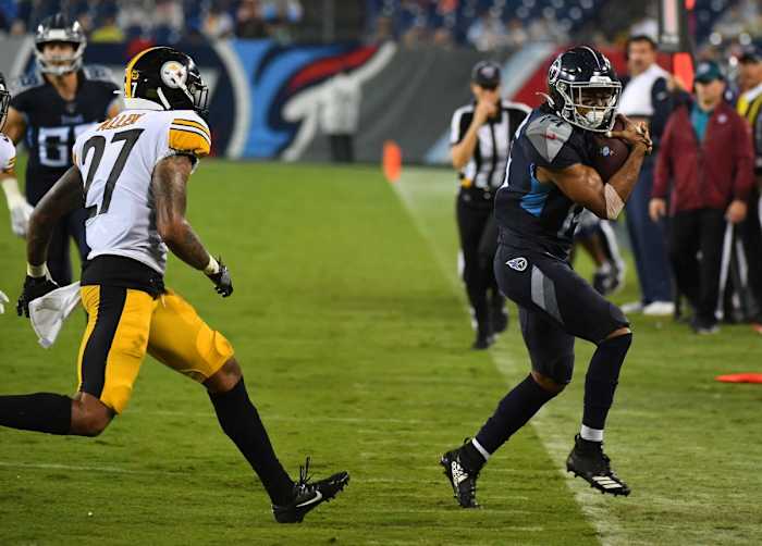 Tennessee Titans wide receiver Kalif Raymond (14) runs out of bounds after a catch during the second half against the Pittsburgh Steelers at Nissan Stadium.